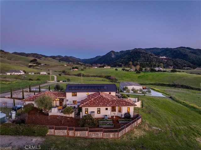 birds eye view of property with a mountain view and a rural view