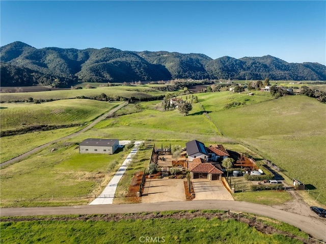 aerial view with a mountain view and a rural view