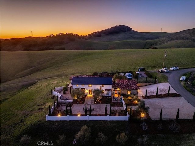 birds eye view of property featuring a mountain view and a rural view