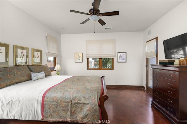 bedroom with multiple windows, visible vents, baseboards, and concrete floors