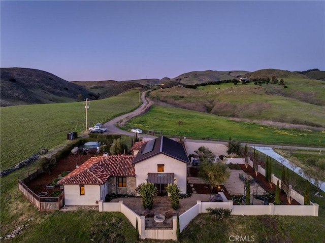 bird's eye view with a rural view and a mountain view