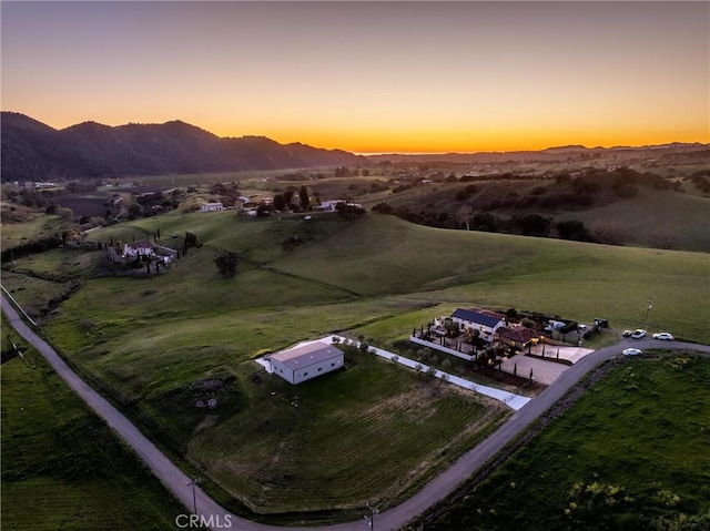 bird's eye view with a rural view and a mountain view