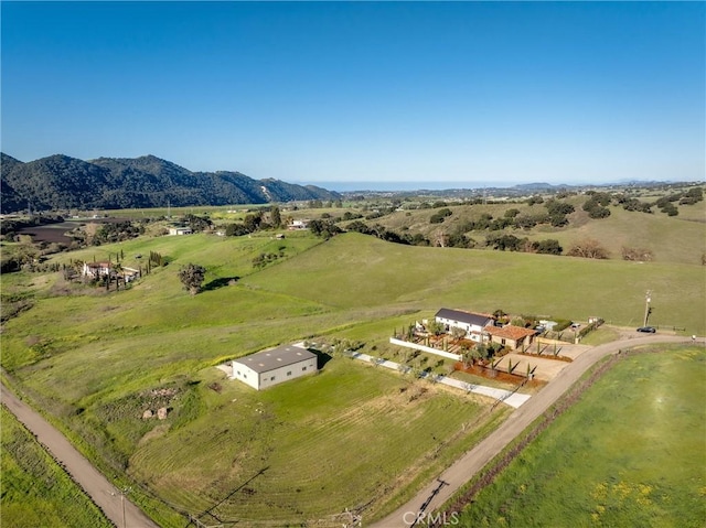 drone / aerial view with a rural view and a mountain view