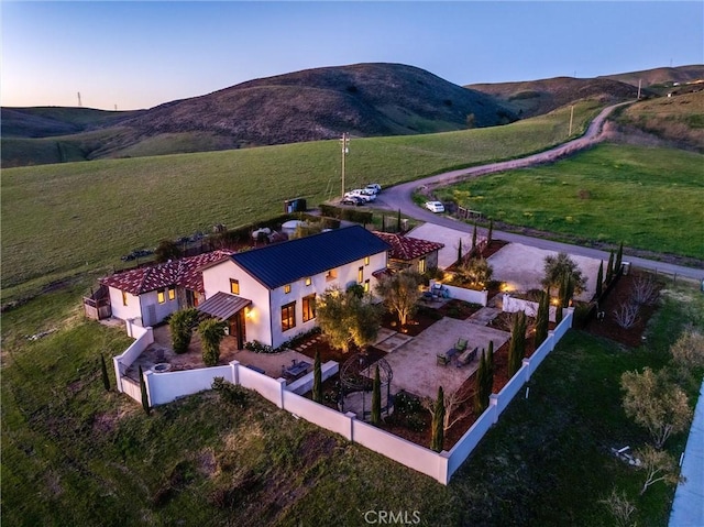 drone / aerial view with a rural view and a mountain view