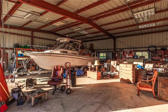 garage featuring a workshop area and metal wall