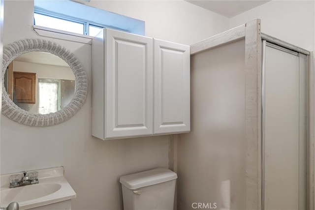 bathroom with toilet and a sink