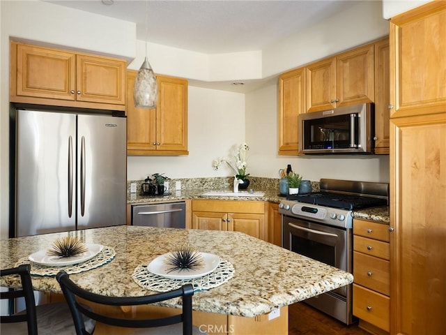 21345 Hawthorne Blvd Unit 415, Torrance, CA 90503 - kitchen with light stone counters, pendant lighting, and stainless steel appliances