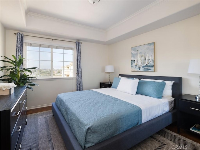 21345 Hawthorne Blvd Unit 415, Torrance, CA 90503 - bedroom with a tray ceiling, baseboards, dark wood-style floors, and ornamental molding