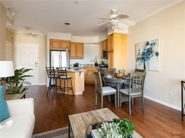 21345 Hawthorne Blvd Unit 415, Torrance, CA 90503 - dining space featuring ceiling fan, crown molding, dark wood-type flooring, and baseboards