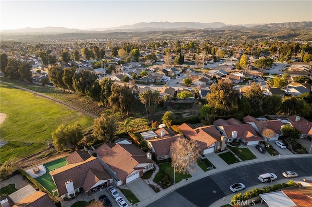 birds eye view of property with a mountain view and a residential view