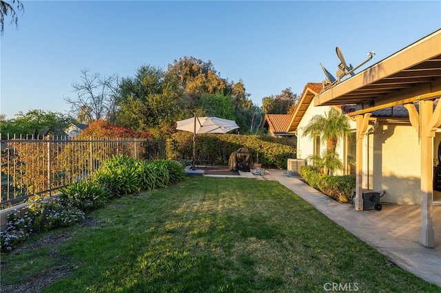 view of yard featuring a patio and a fenced backyard