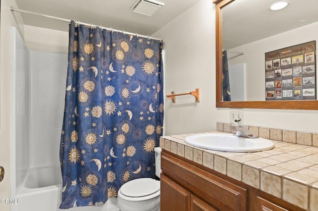 full bathroom featuring visible vents, toilet, vanity, and shower / tub combo