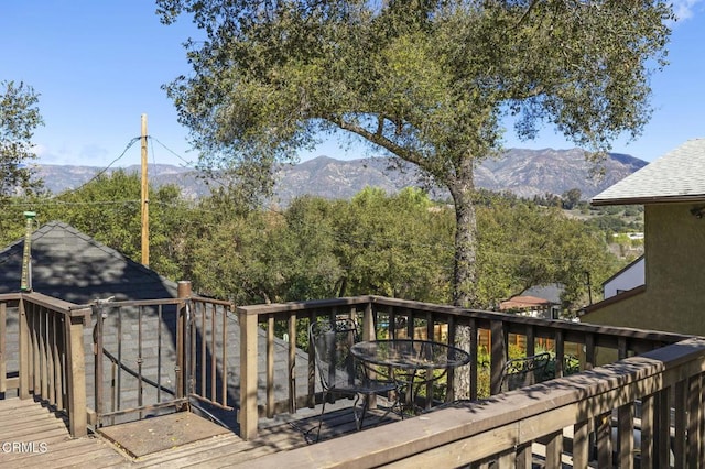 wooden terrace with a mountain view