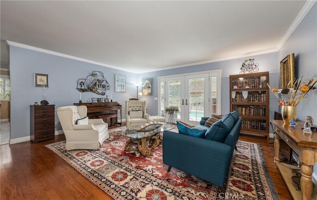 living room with french doors, a healthy amount of sunlight, wood finished floors, and crown molding