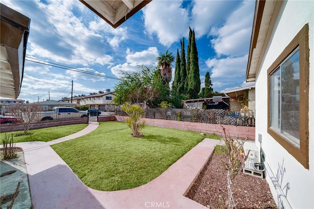 view of yard with a fenced backyard