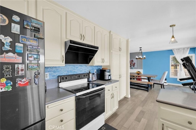 kitchen featuring range hood, white electric stove, freestanding refrigerator, decorative backsplash, and light wood-style floors