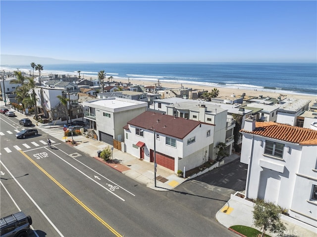 bird's eye view featuring a beach view, a residential view, and a water view