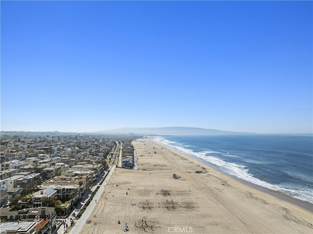 drone / aerial view with a view of the beach and a water view