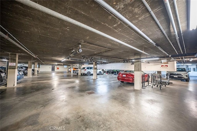 parking garage featuring a garage door opener