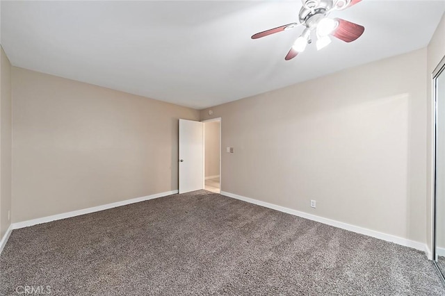 unfurnished room featuring carpet, baseboards, and ceiling fan