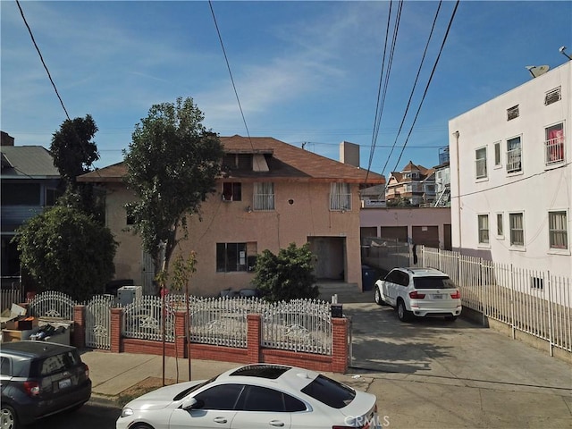 view of building exterior featuring a fenced front yard