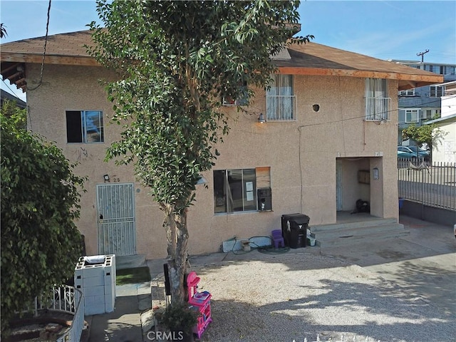 view of property with fence