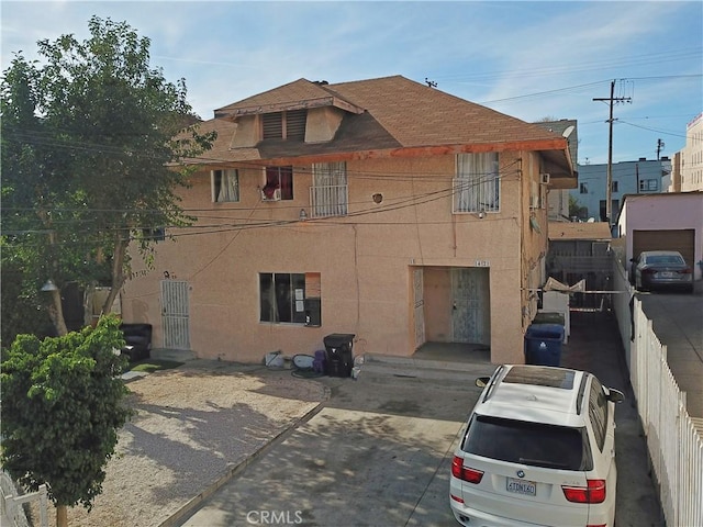 view of property with fence