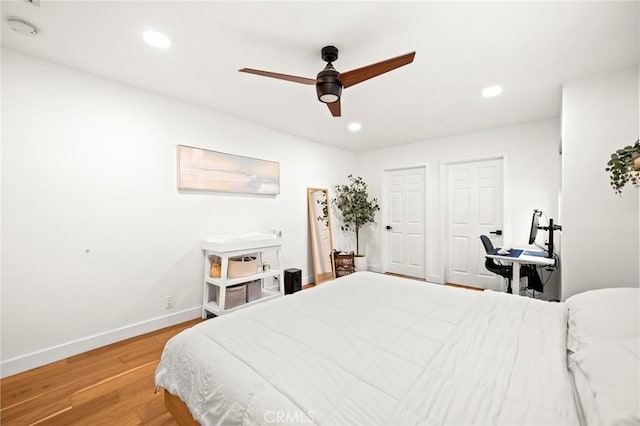 3345 Oakhurst Ave, Los Angeles, CA 90034 - bedroom with light wood-type flooring, baseboards, recessed lighting, and a ceiling fan