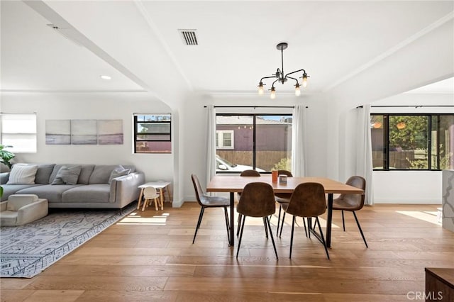 3345 Oakhurst Ave, Los Angeles, CA 90034 - dining area with a chandelier, light wood finished floors, baseboards, recessed lighting, and crown molding