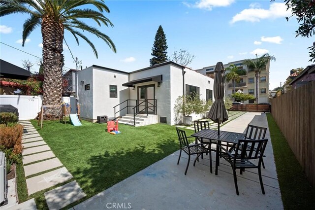 3345 Oakhurst Ave, Los Angeles, CA 90034 - view of patio / terrace featuring outdoor dining space and a playground