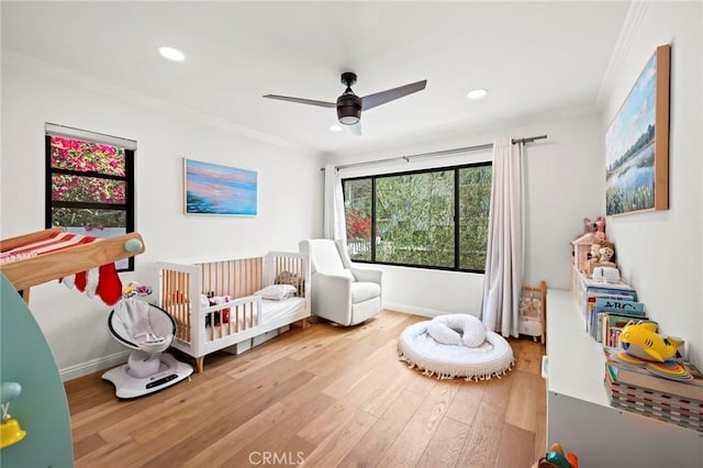 3345 Oakhurst Ave, Los Angeles, CA 90034 - bedroom with ornamental molding, a nursery area, wood finished floors, recessed lighting, and a ceiling fan