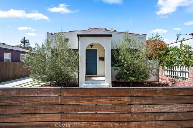 3345 Oakhurst Ave, Los Angeles, CA 90034 - mediterranean / spanish-style home featuring a fenced front yard and stucco siding