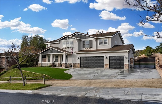 craftsman-style home with stucco siding, stone siding, a front yard, and fence