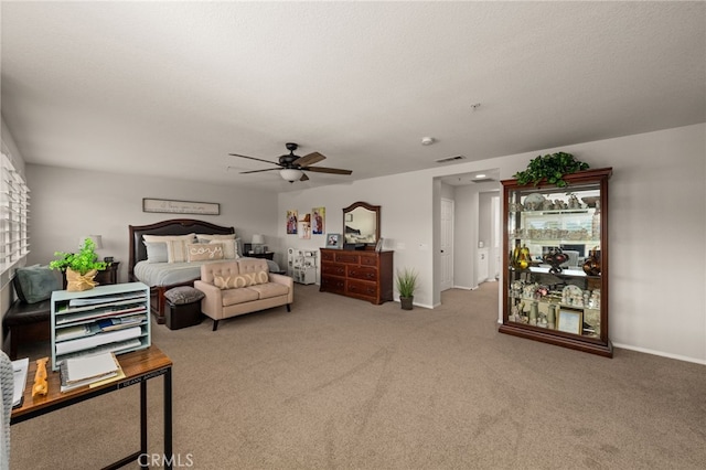 bedroom with a ceiling fan, carpet, visible vents, and baseboards