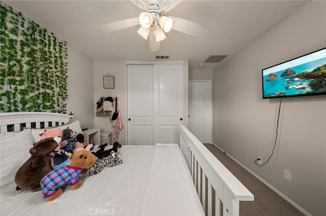 bedroom featuring carpet, visible vents, baseboards, ceiling fan, and a closet