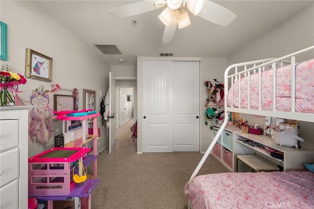 carpeted bedroom featuring a ceiling fan, visible vents, and a closet