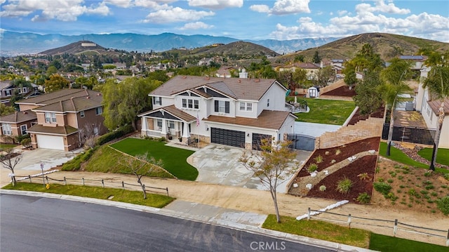 aerial view with a mountain view and a residential view