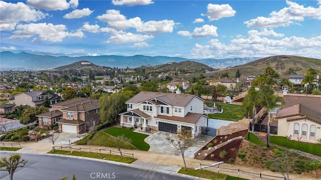 aerial view featuring a mountain view and a residential view