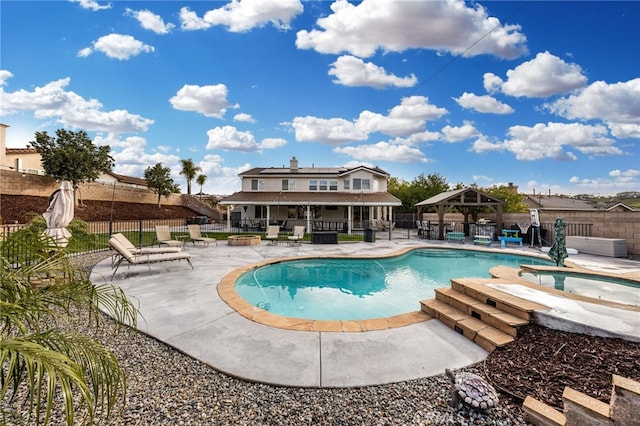 view of pool with fence, a gazebo, a fenced in pool, an in ground hot tub, and a patio area