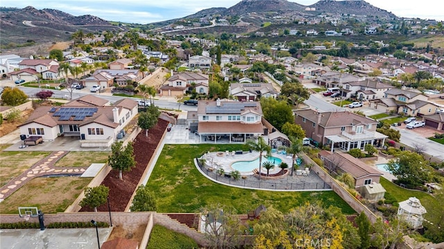 drone / aerial view featuring a mountain view and a residential view