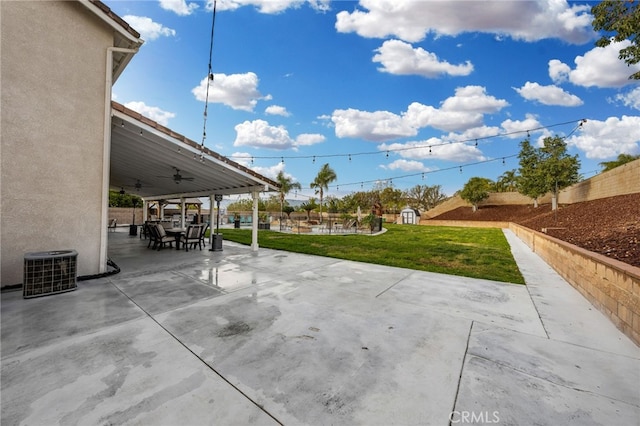 view of patio / terrace with central air condition unit, ceiling fan, and fence