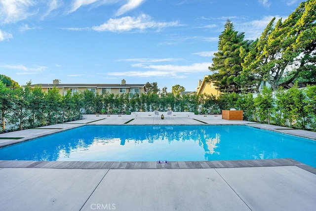 outdoor pool with a patio