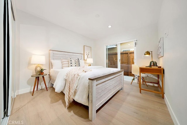 bedroom with recessed lighting, light wood-style flooring, and baseboards