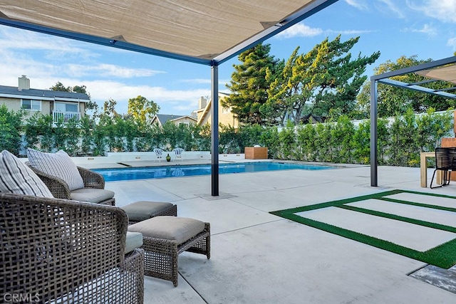 view of patio / terrace with a fenced backyard and an outdoor pool