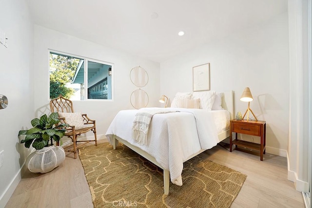 bedroom featuring recessed lighting, light wood-style flooring, and baseboards