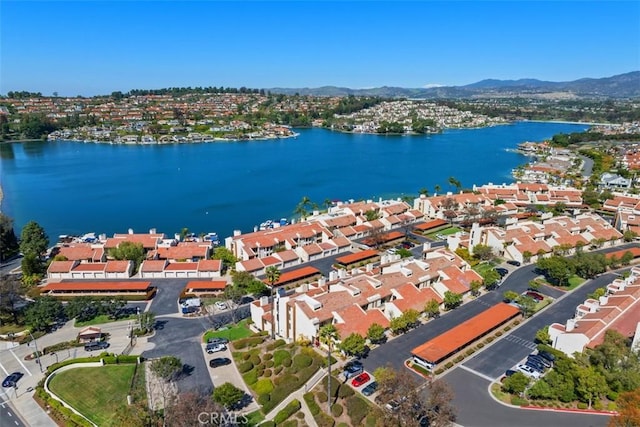 aerial view featuring a water and mountain view