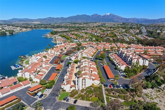 birds eye view of property featuring a residential view and a water and mountain view