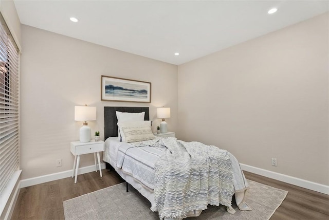 bedroom featuring recessed lighting, baseboards, and wood finished floors