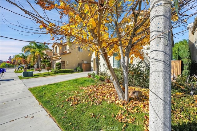 view of front of house featuring stucco siding and concrete driveway