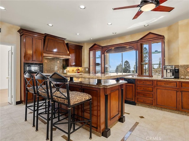 kitchen featuring recessed lighting, backsplash, black microwave, and custom range hood